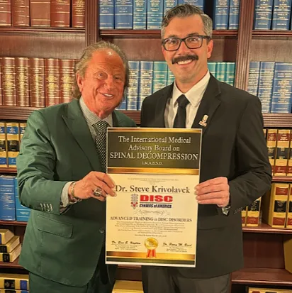 Dr. Krivolavek accepting a back pain treatment award